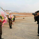 Image for article titled Kim Jong Un Visits Female Fighter Pilots, Picks Up Camera For Photo Op